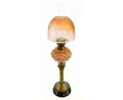 A late Victorian oil lamp, the cloudy glass reservoir with opaque detail and frosted glass shade, terminating on a Corinthian