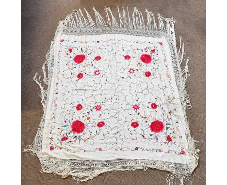 A floral embroidered silk panel with broad tassel fringe, approx. 140 x 140cm.