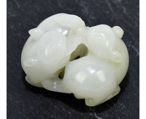 A Chinese jade carving, depicting cats playing with a butterfly, width 4cm.Condition Report: All four ears with some grazes a