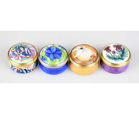 MOORCROFT; four enamel pill boxes and covers of circular form, including an example by Marie Graves in the 'Midsummer Queen' 