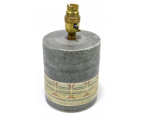 LOUISE JINKS FOR TROIKA POTTERY; a cylinder lamp base of squat form with a single band of circles on a green ground, signed '