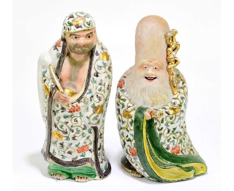 A pair of Japanese ceramic figures of Immortals, height 24cm (2).