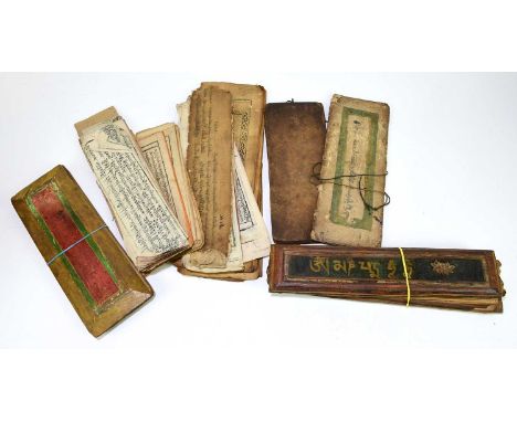 Two 18th / 19th century Tibetan hand written prayer books, with painted wood panel ends, the longest 34.5cm, with two hand wr