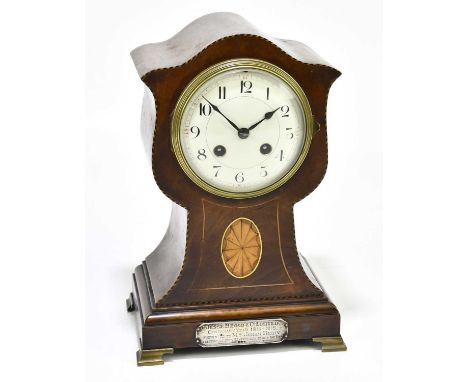An Edwardian inlaid mahogany eight day mantel clock, the enamel dial with Roman numerals, with silver presentation plate to t