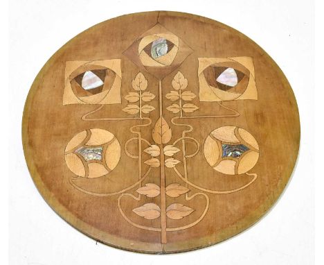An Arts and Crafts mother of pearl and abalone inlaid panel of circular form, diameter 32cm.