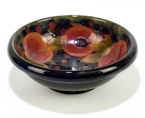 MOORCROFT; a 'Pomegranate' pattern bowl, with shaped rim, impressed marks and painted William Moorcroft signature, diameter 1