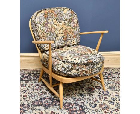 ERCOL; a beech lounge chair, with tapered legs, height 78cm.