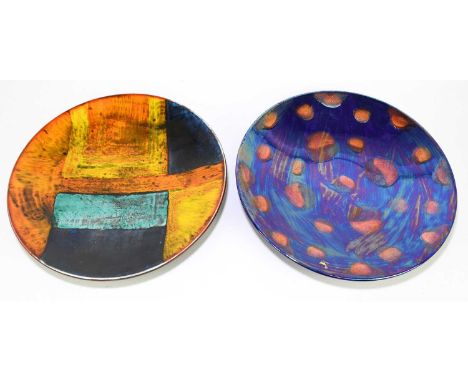 POOLE POTTERY; two large circular wall chargers, including a lustre example decorated with circular matte glazed motifs, diam