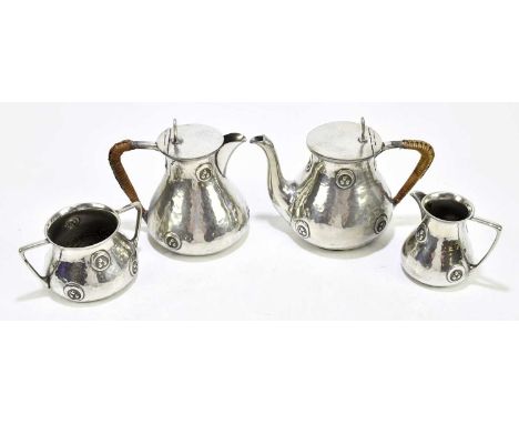 WILLIAM HUTTON &amp; SONS, CUNNELL CHEAPSIDE; an English pewter four piece tea service comprising teapot, hot water jug, each