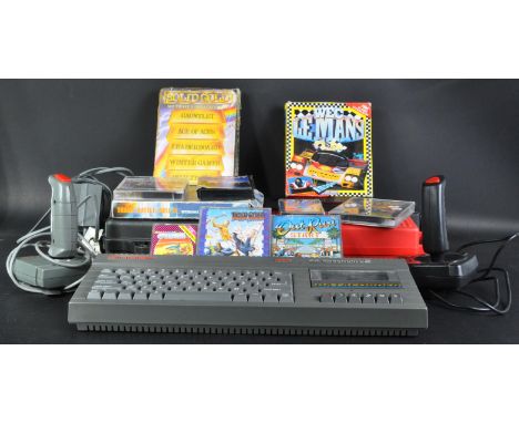 A original vintage Sinclair made ZX Spectrum computer video game console with games and accessories comprising&nbsp;a 128K +2