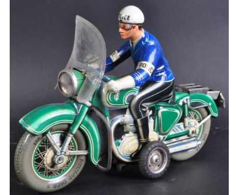 An original vintage West Germany Tippco made pressed tinplate friction motor motorcycle having original windscreen with Tippc