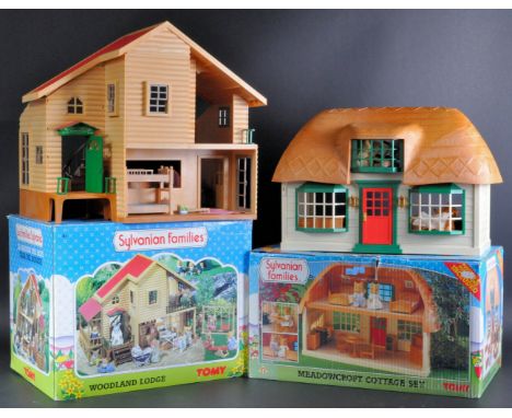 Two vintage Tomy made Sylvanian Families model house sets comprising No. 3454 Woodland Lodge and 3182 Meadow Croft Cottage. B