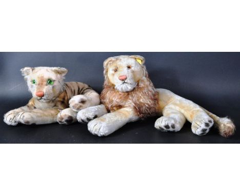 Two original vintage circa 1960's German Steiff made soft toy teddy bears in the form of a Lion and Tiger. The Lion having a 