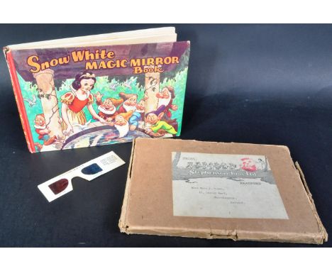 A vintage Walt Disney's Snow White and the Seven Dwarfs Magic Mirror Book. The hardback book having monochrome illustrations 