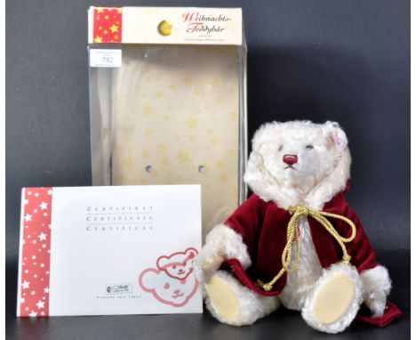 An original vintage Limited Edition German Steiff made soft toy teddy bear 037580 Musical Christmas Teddy Bear. The bear with