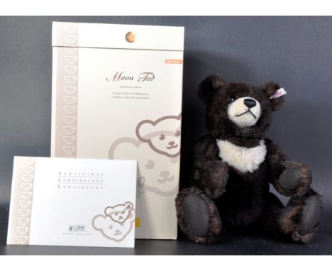 An original vintage Limited Edition German Steiff made soft toy teddy bear 662423 ' Moon Ted '. The bear having dark brown mo