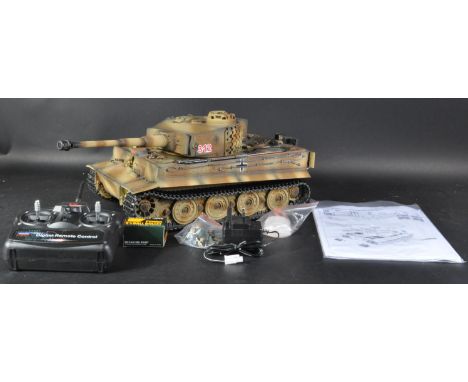 An original Taigen made 1/6 scale RC radio controlled German Tiger 1 tank. The detailed model having forward and backward hig