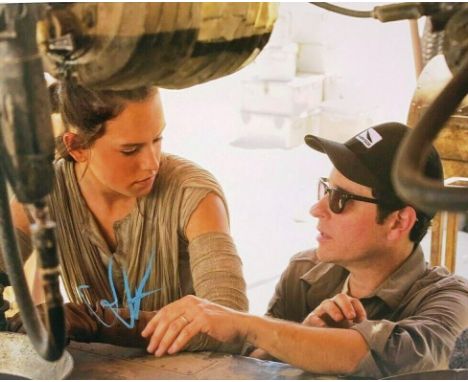 Star Wars - JJ Abrams (Director) - autographed 11x14" photograph showing Abrams alongside Daisy Ridley, on set. Signed in blu