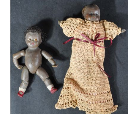 Two early to mid 20th Century wax made miniature dolls / dollies. The first completely made of wax, including arms and legs, 