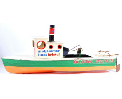A retro mid 20th Century live boat / scratch built model in the form a steam boat fitted with a Mamod engine and rudders and 