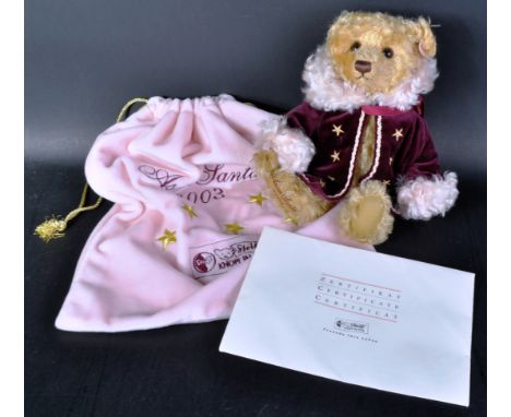 A Limited Edition German Steiff made soft toy teddy bear 975911 ' Asian Santa Teddy Bear 2003 '. The bear having blonde mohai