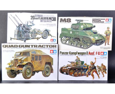 A collection of x4 vintage Tamiya 1/35 scale Military themed plastic model kits to include; Quad Gun Tractor, M8 Howitzer Mot