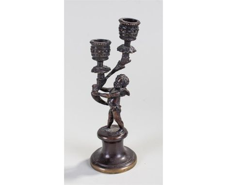 Bronzed candlestick, cherub figure, 24 cm in height