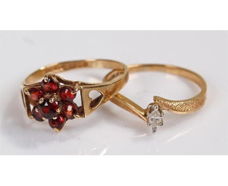 9 carat gold garnet set ring, together with a 10 carat gold ring, 3.1 grams