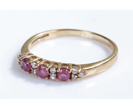 9 carat gold ring, set with purple stones, 2.2 grams