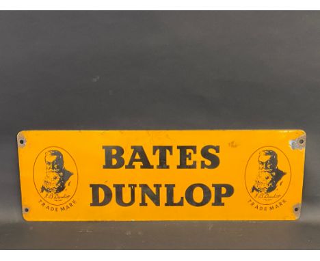 A Bates Dunlop rectangular enamel sign of small size with an image of J.B. Dunlop to each end, 24 x 8".