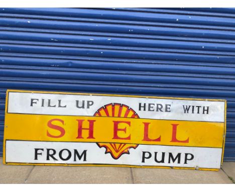 A Shell 'Fill up here from the pump' enamel sign, heavily restored.