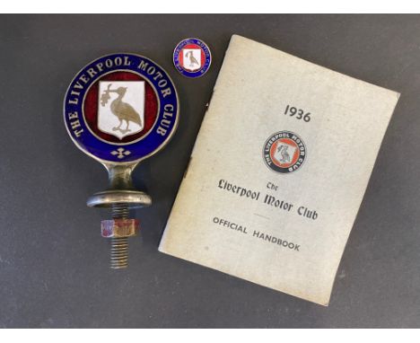 A rare Liverpool Motor Car club badge, in red and blue enamel, sold with a matching lapel badge and an official handbook.