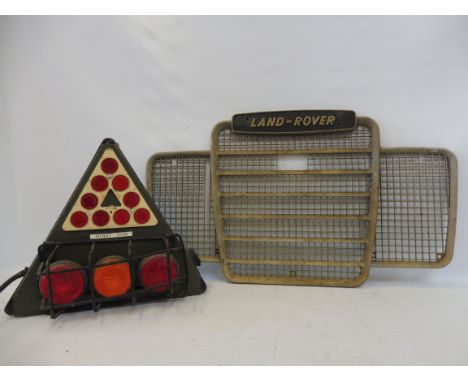 A Land Rover radiator grille plus a military issue trailer light cluster. 