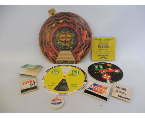 A collection of garage advertising items including BP, Duckhams, Total, Mobil, Esso and Amoco.