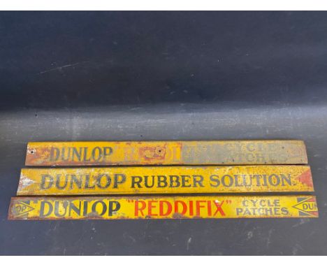 Three Dunlop bicycle tin shelf strips. 