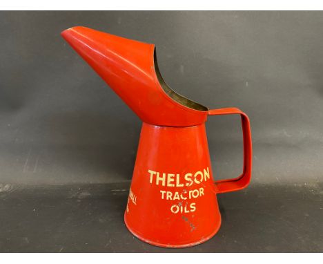 A Thelson Tractor Oils quart measure, in good condition. 