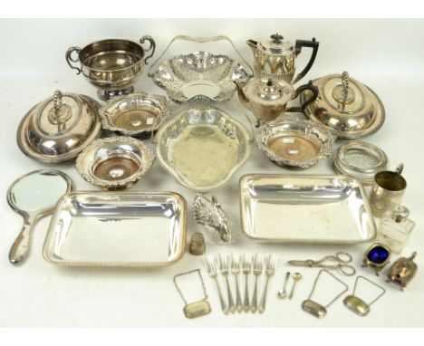 A selection of silver and silver-plated wares to include a pair of entrée dishes, pierced swing handled basket, wine bottle s