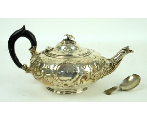 Victorian silver teapot with embossed decoration, on round foot, by Daniel &amp; Charles Houle, London, 1855 and a caddy spoo