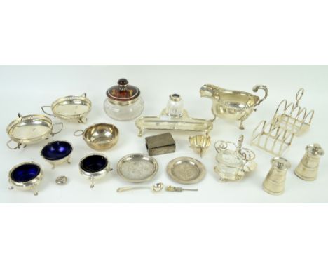 Silver desk stand and inkwell, sauceboat, toast racks, pair of pepper grinders and other items,