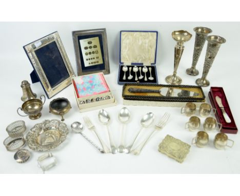 Mixed group of silver items, including a pair of bud vases with filled bases, salts, photo-frames, small sterling tot cups, s