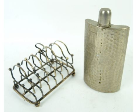 Silver toast rack and a hip flask