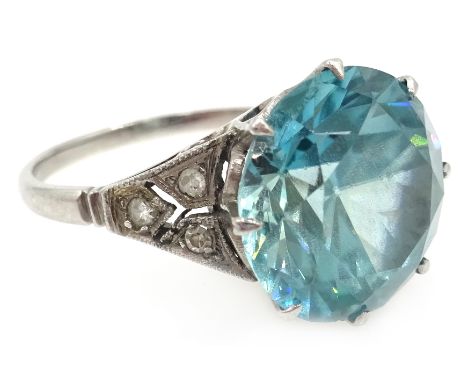 18ct white gold (tested) blue zircon ring, with diamond set shoulders Condition Report Approx 5.5gm, size Q-R. The zircon is 