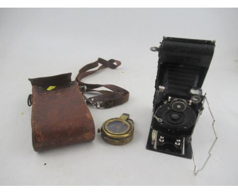 A ICA Dresden folding camera, together with a Short &amp; mason Ltd London Army issue compass, in brass case, No. 99726 1917