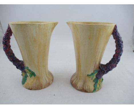 A pair of Clarice Cliff Bizarre My Garden pattern jugs, height 9.25&nbsp;