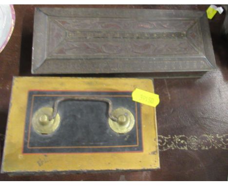 A vintage money tin, together with another tin and coins