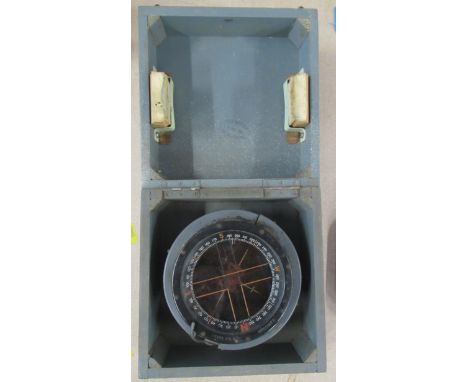 A Navy issue compass, in wooden box