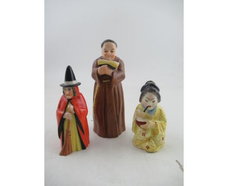 Three Royal Worcester candle snuffers, a monk, a witch and a Japanese girl&nbsp;