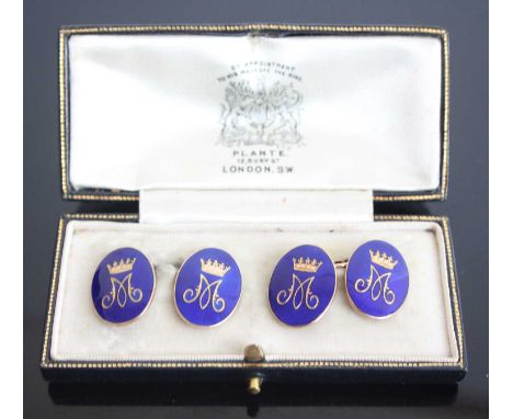 A pair of gilt metal double ended cufflinks, the oval plates with blue enamel inlay and M monogram with crown, gross weight 1