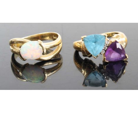 A modern 14ct gold and opal cabochon set dress ring, size N, together with a modern 14ct gold trilliant cut amethyst and topa