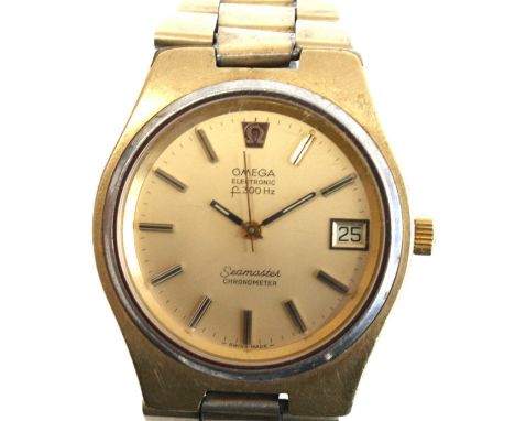 A gent's gold plated Omega Electronic f300 H2 Seamaster chronometer wrist watch with round champagne baton dial and date at 3